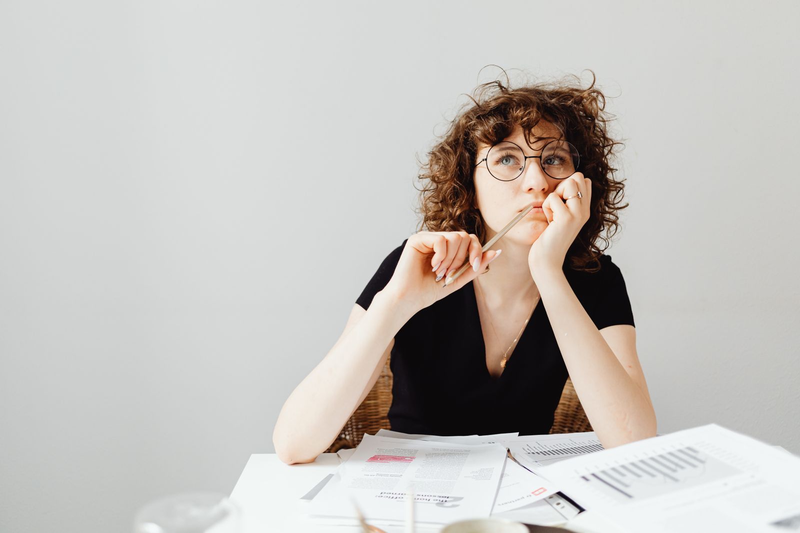 An HR leader reading and thinking alone over the numbers.