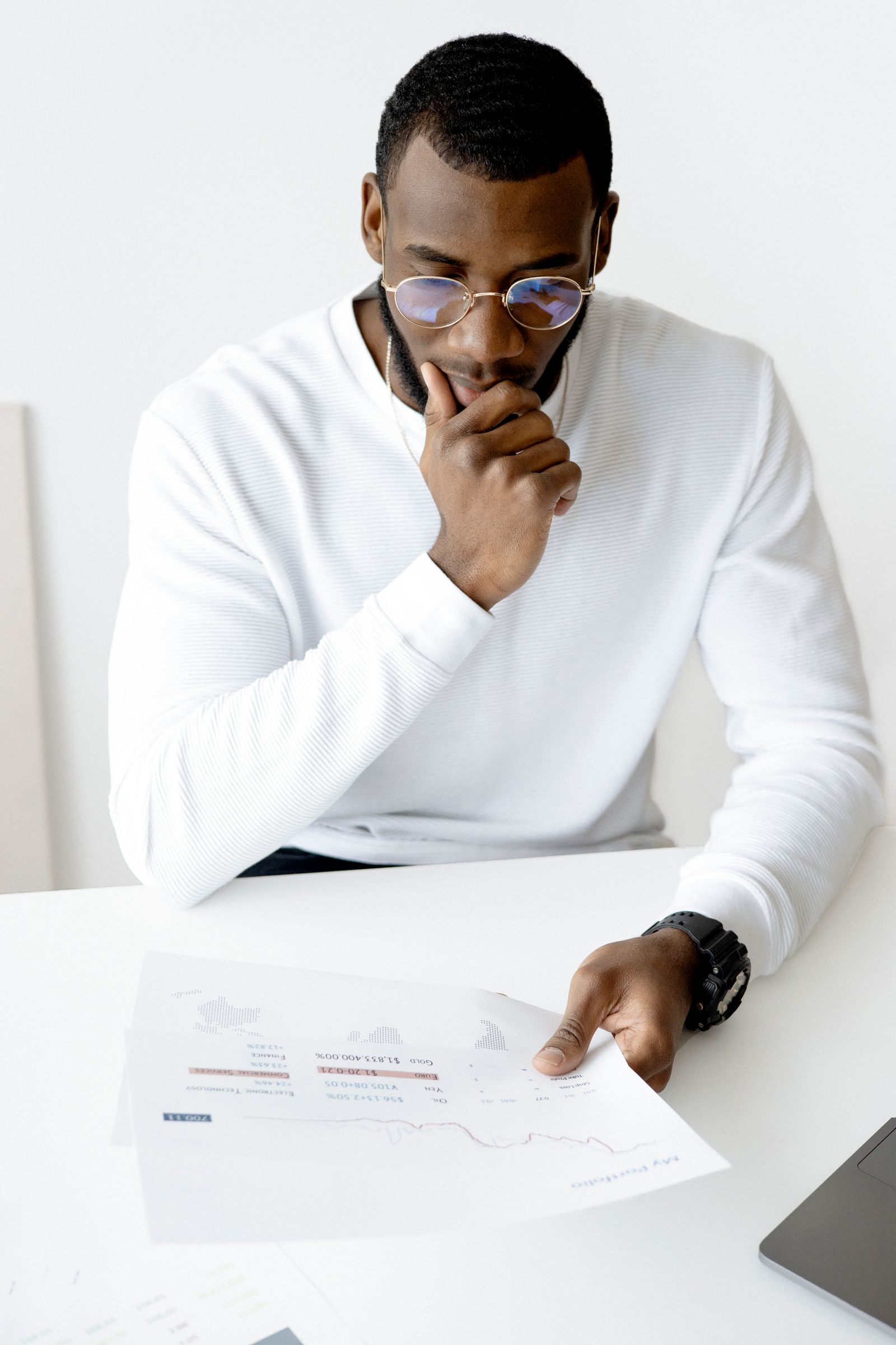 A manager pausing to think and prepare before a conversation.